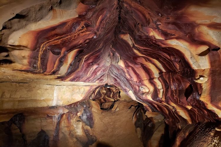 A photo showing the inside of the Ohio Caverns. It has a mirrored reflection from standing water. Photo retrieved from Ohio Caverns website.